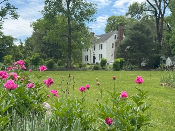 House close up with peonies 2025