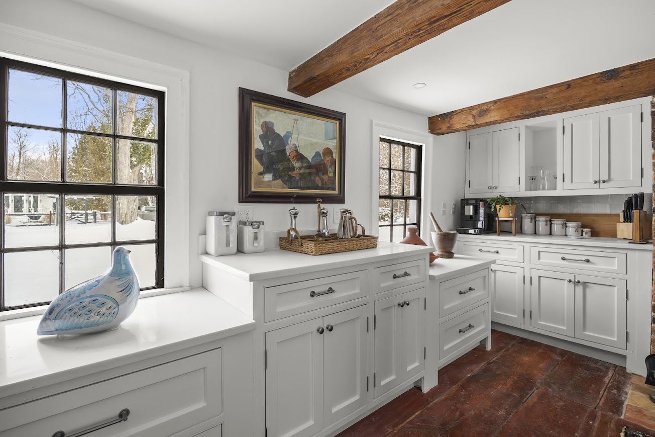 21 – Window cabinetry with view of pool house