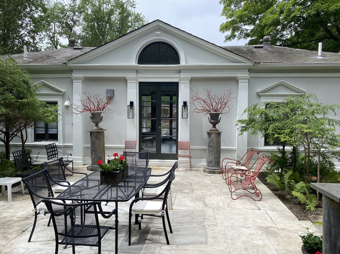 65 – Al fresco dining area off of kitchen in Poolhouse