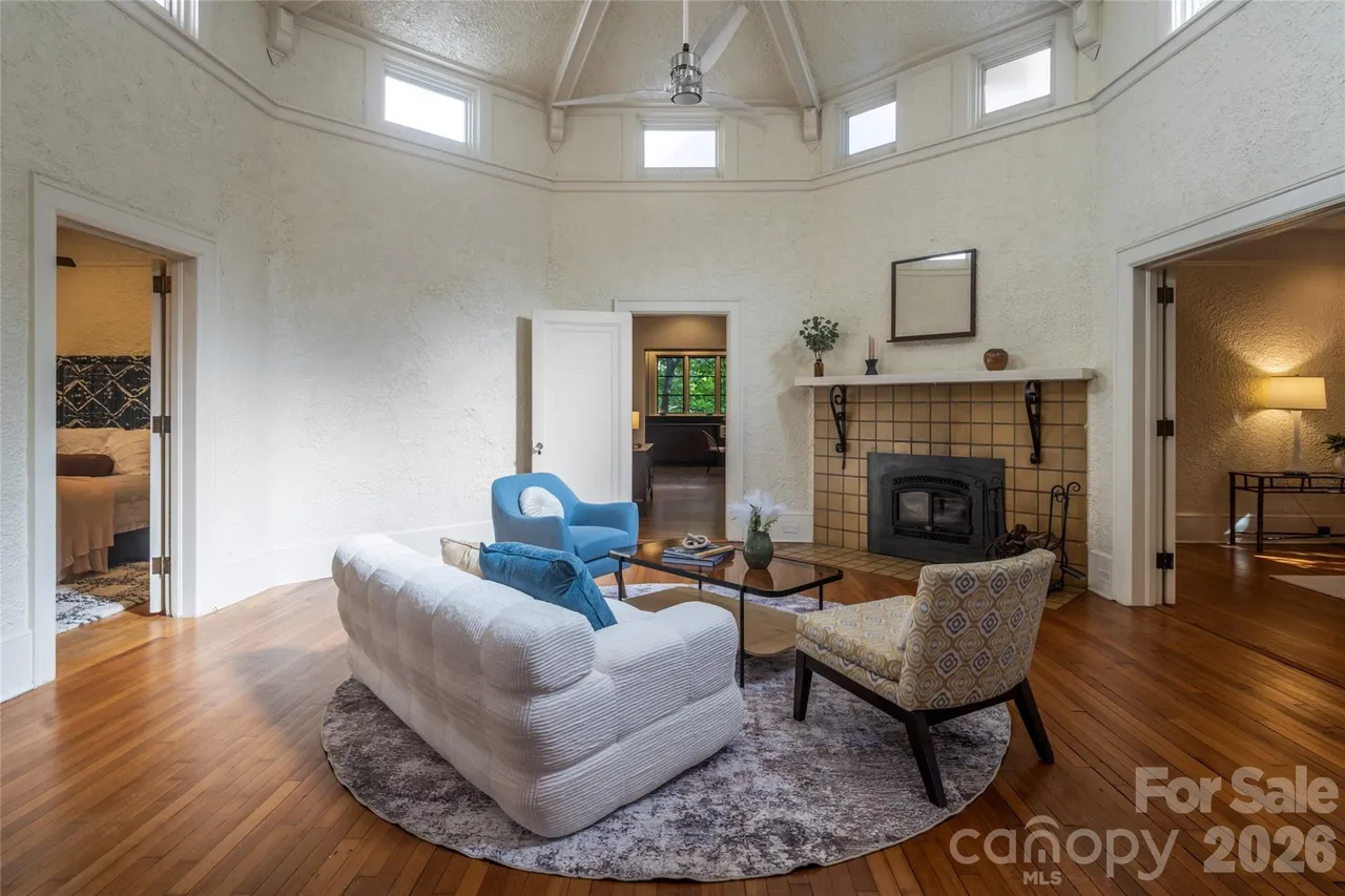 Light-filled living room with custom built-ins and historic architectural details